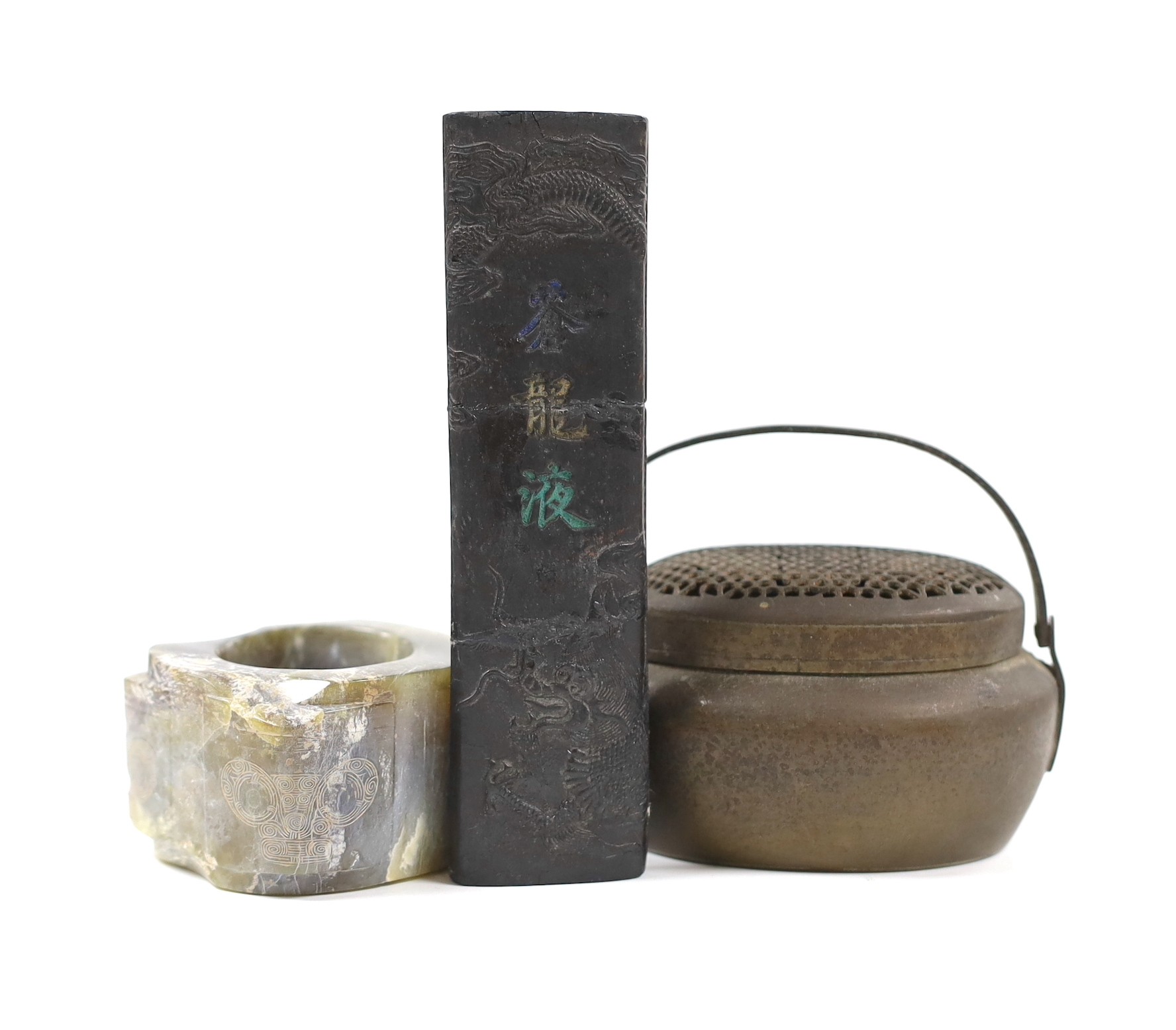 A Chinese bronze hand warmer, together with an inscribed inkstick, 16cm wide, and a hardstone carving